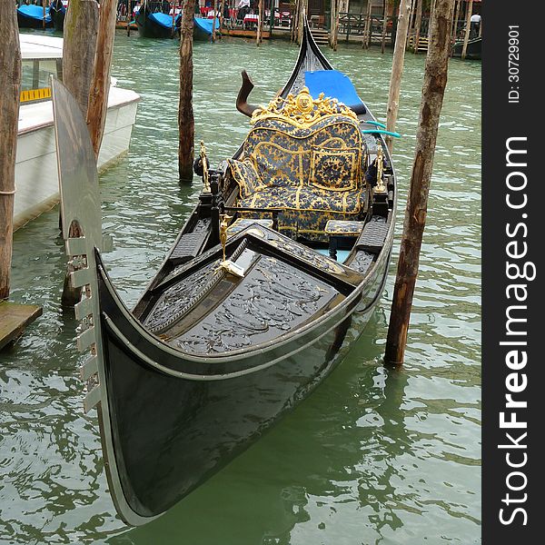 Venice - a detailed view of a gondola on the Canal Grande. Venice - a detailed view of a gondola on the Canal Grande