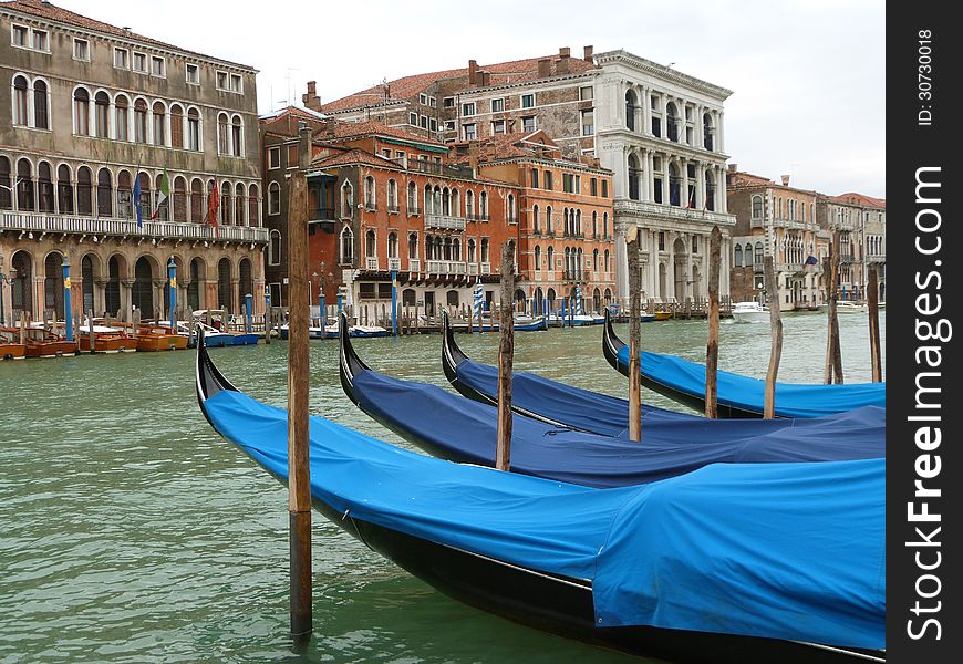 Venice - a view of the Grand Canal with gondolas and boats. Venice - a view of the Grand Canal with gondolas and boats