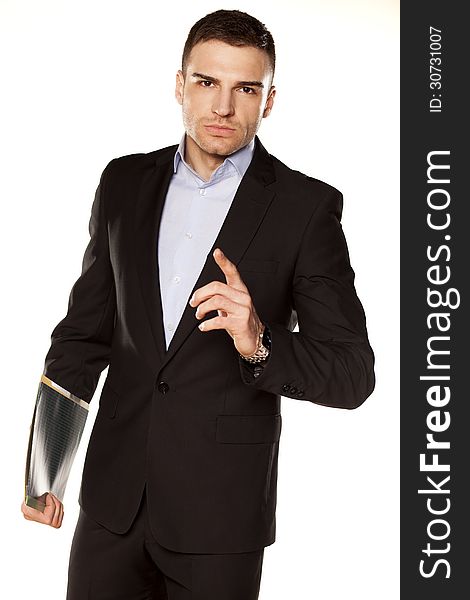 Angry young businessman with folder