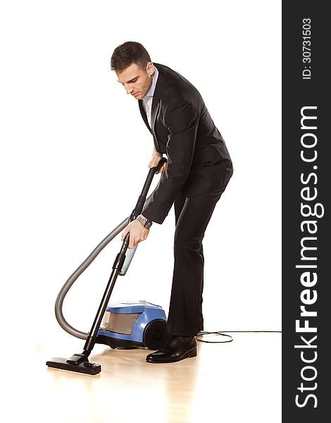Young attractive businessman with a vacuum cleaner. Young attractive businessman with a vacuum cleaner