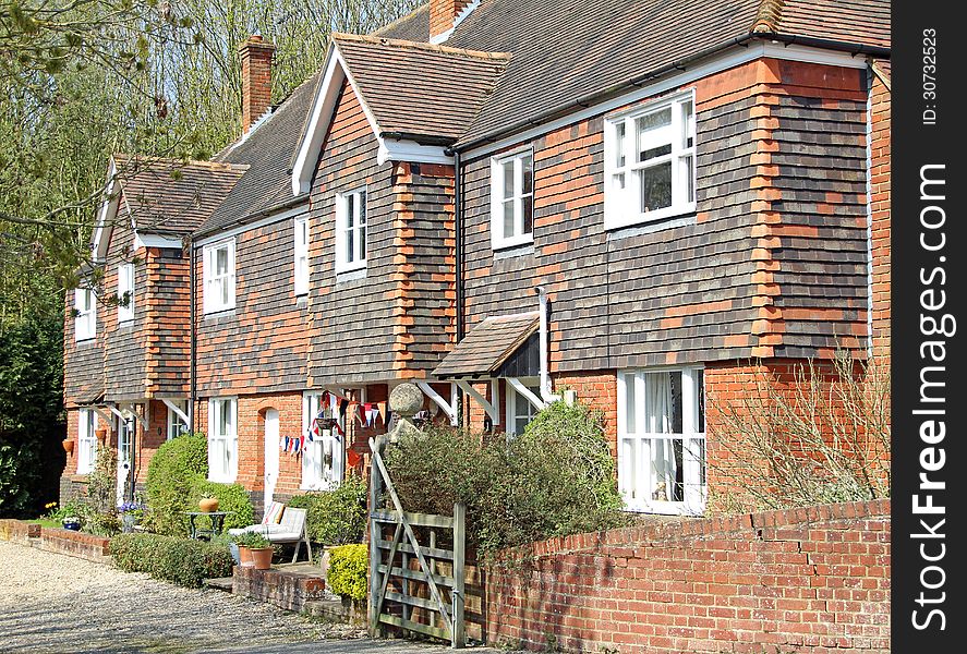 Photo of red brick rural kent cottages located in the tranquil village of harbledown. photo taken 1st may 2013.