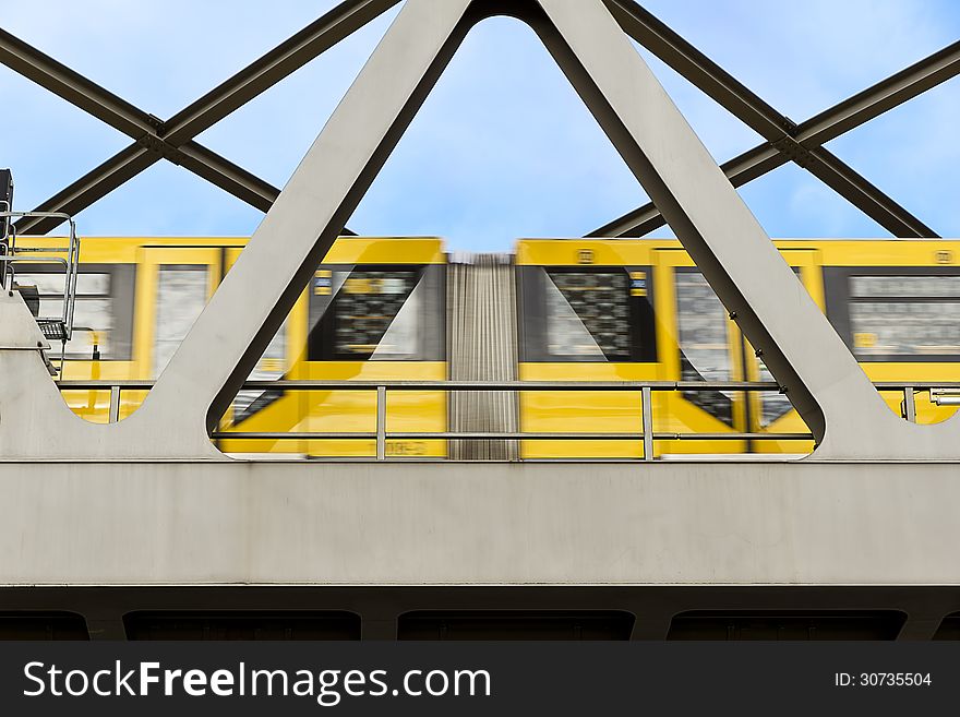 Yellow Moving Tram On A Bridge In Berlin