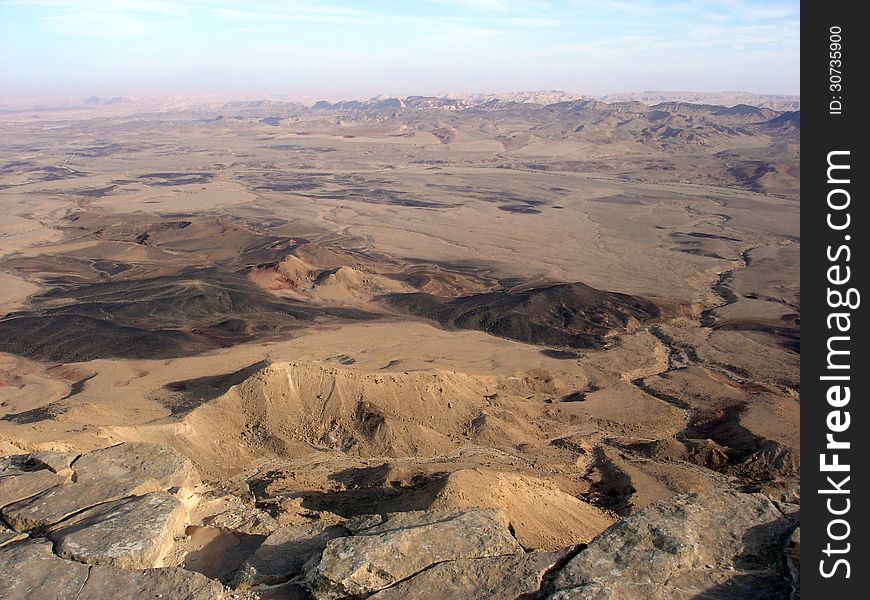 Aerial view of Ramon Crater - Makhtesh Ramon in the Negev Desert at the south region of Israel. Aerial view of Ramon Crater - Makhtesh Ramon in the Negev Desert at the south region of Israel.