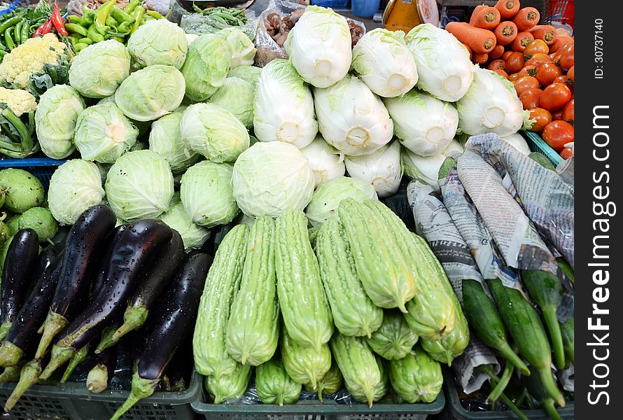 Assorted fruit and vegetable trays in the street market, thailand