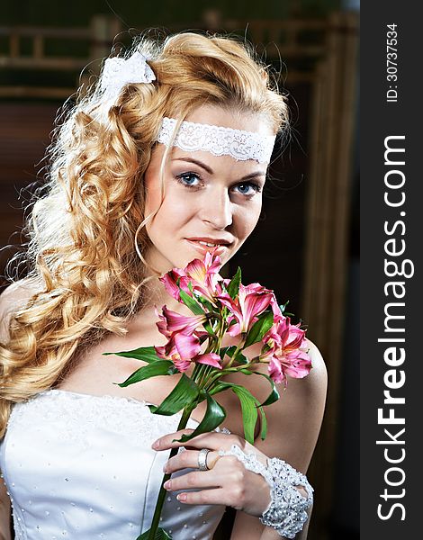 Portrait beautiful bride with bouquet of lily