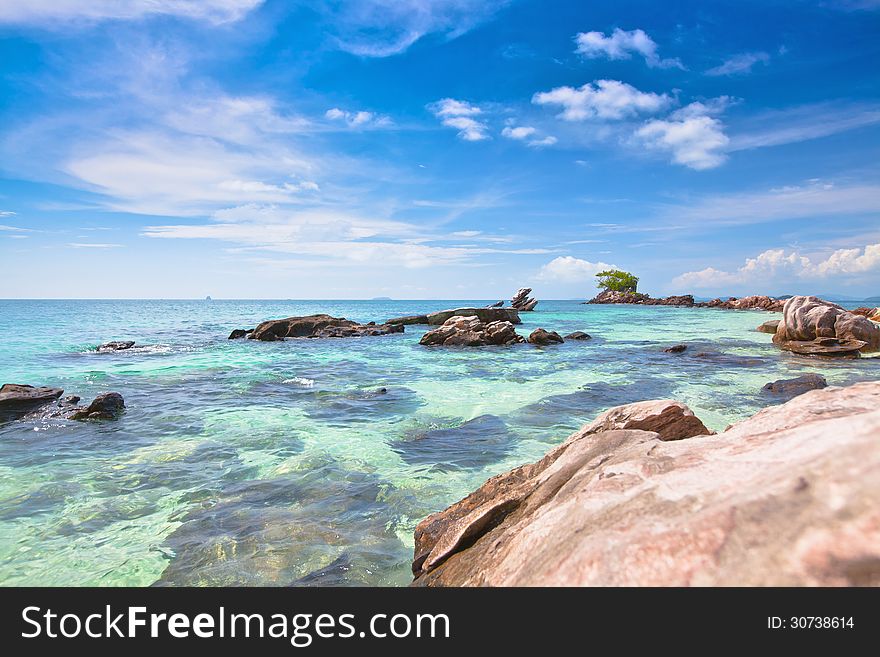 Sea coast with stones and blue sky. Sea coast with stones and blue sky