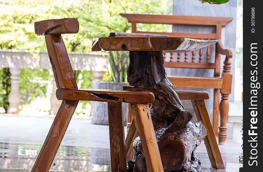 Wooden chairs and tables on the terrace at rest.