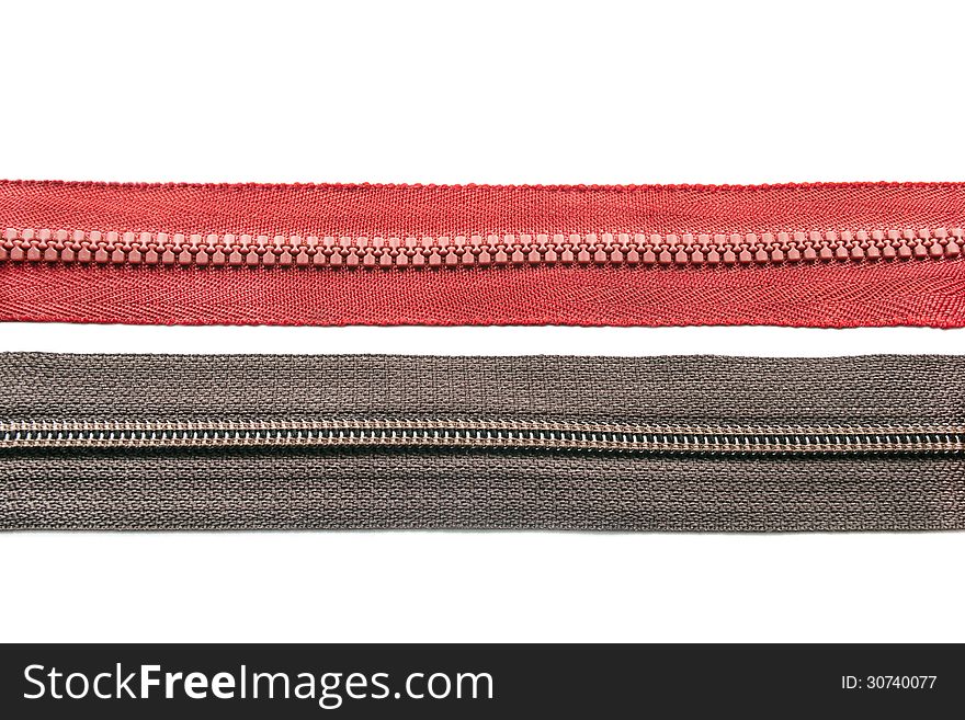 Two fastened zippers isolated over white. Two fastened zippers isolated over white