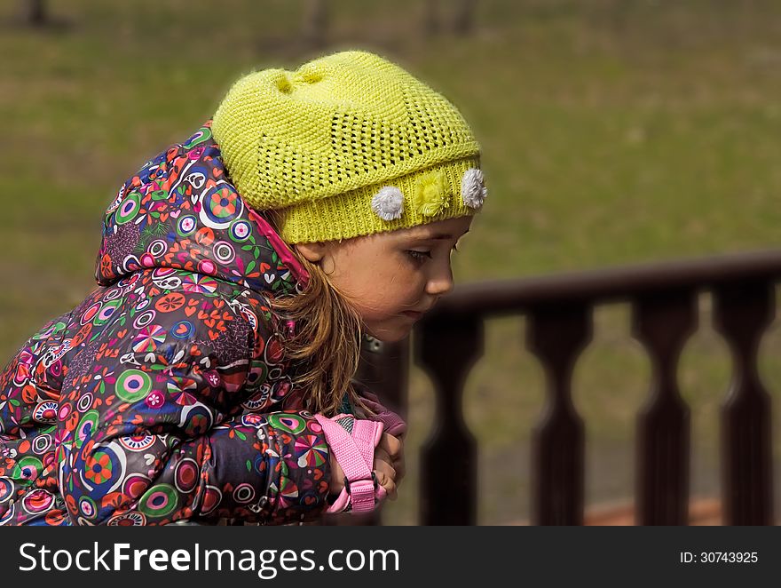 Girl standing at the fence. Girl standing at the fence