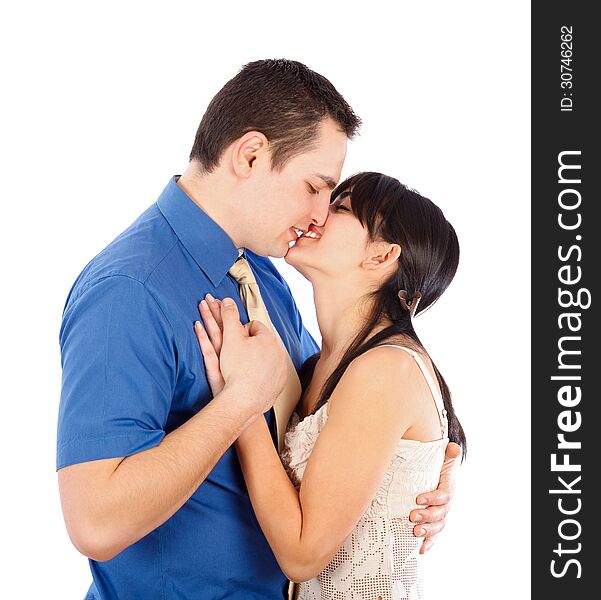 Young couple having an intimate moment - kissing. Young couple having an intimate moment - kissing.