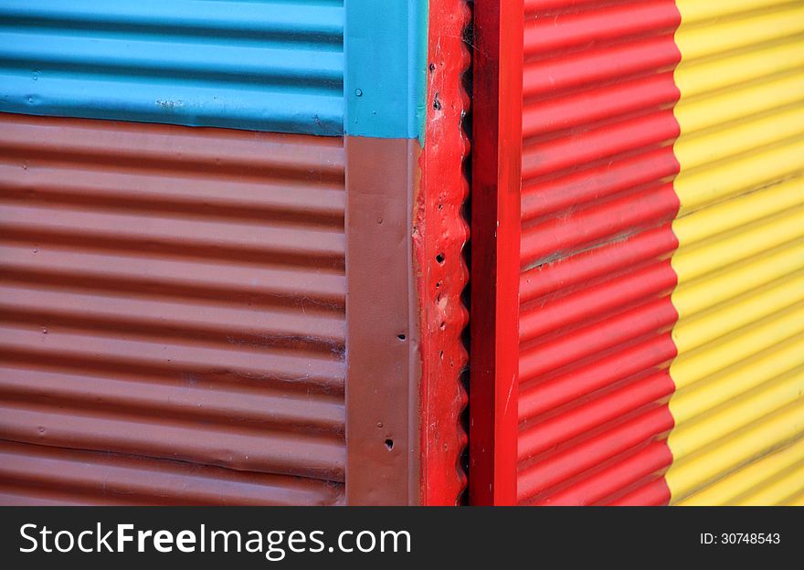 Color wall of the house from iron sheets. Caminito.