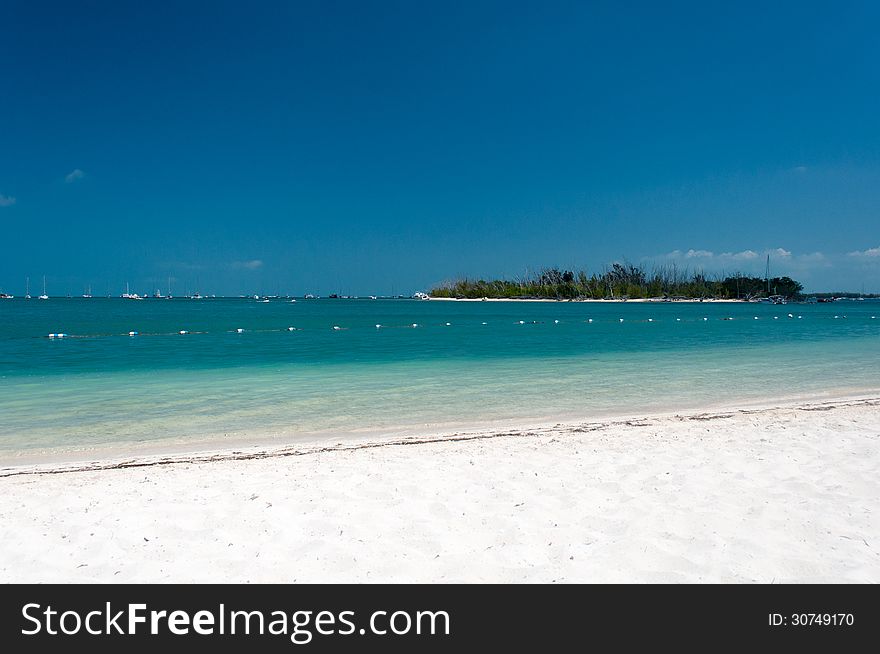 Sandy beach with a view of a small island. Sandy beach with a view of a small island