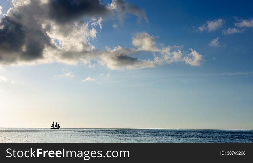 Silhouette of a Sailboat on the Horizon. Silhouette of a Sailboat on the Horizon
