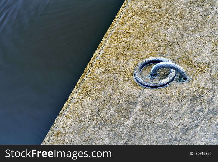 Metal moorings a for boats. River Neris, high water. Metal moorings a for boats. River Neris, high water