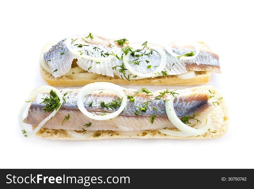 Sandwiches with herring, onions and herbs, isolated