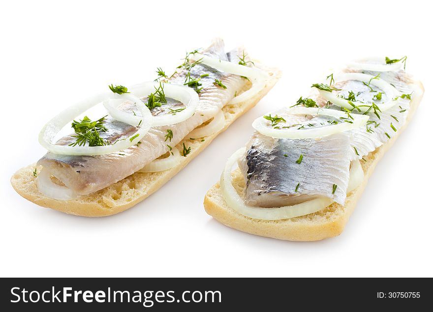 Sandwiches with herring, onions and herbs, isolated