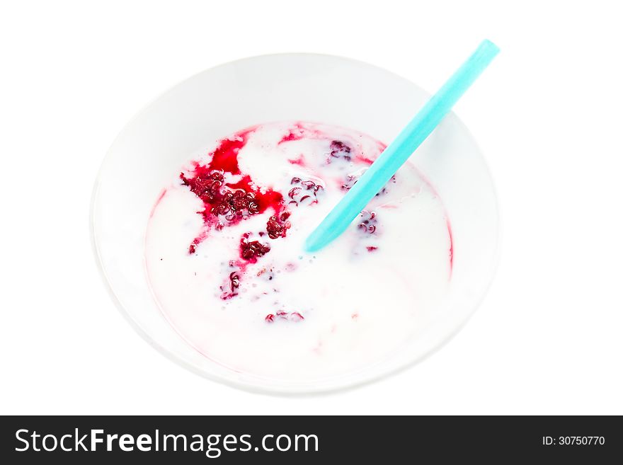 Fresh yogurt with blackberry in a white bowl with straw isolated on white background. Fresh yogurt with blackberry in a white bowl with straw isolated on white background