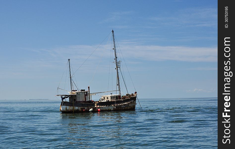 Old Rusty Boat anchored offshore. Old Rusty Boat anchored offshore