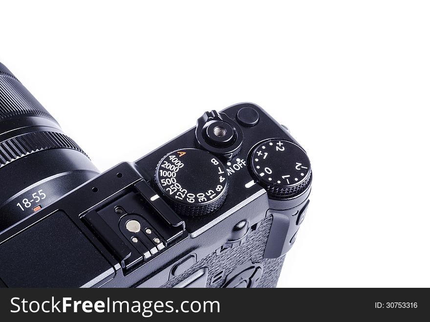 Controls of a black compact system camera isolated on white. Controls of a black compact system camera isolated on white.