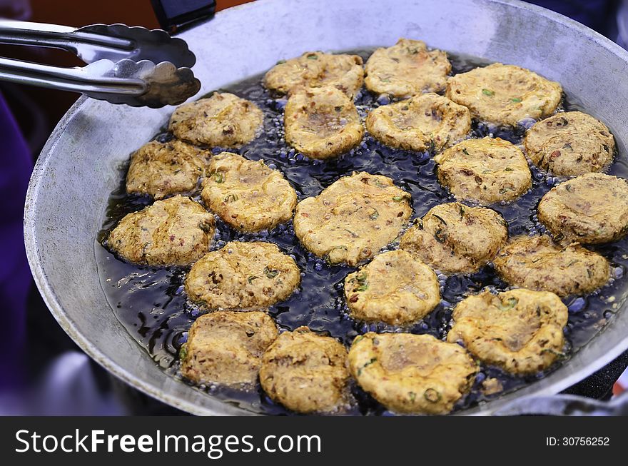 Fried fish in frying pan