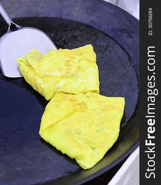 Omelette in the pan at restaurant