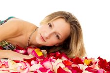 Beautiful Girl Lies In Rose Petals Stock Photography