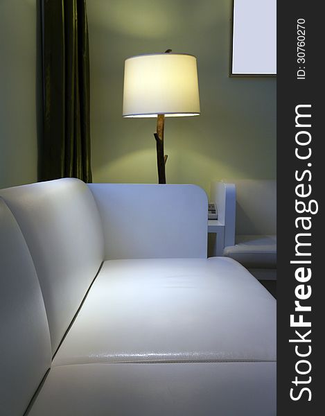 Photo of sofa and standard light. Photo of sofa and standard light.