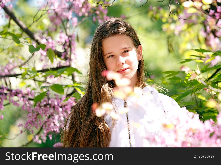 Beautiful spring girl in the park