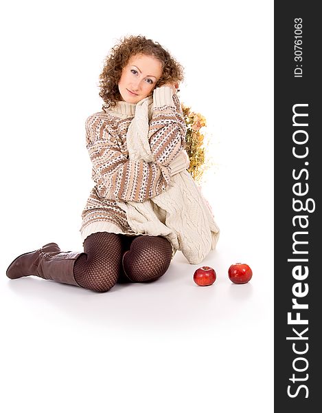 Beautiful Girl In A Sweater Sitting With Apples