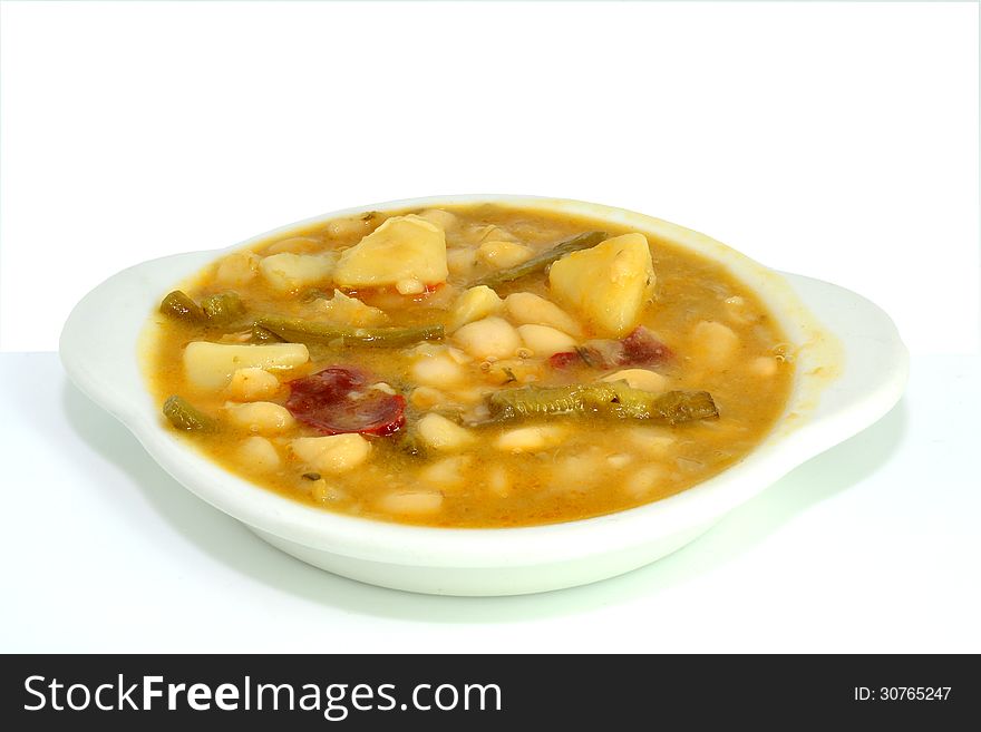 Bean stew with potatoes, pepper and a kind of asparagus. Bean stew with potatoes, pepper and a kind of asparagus