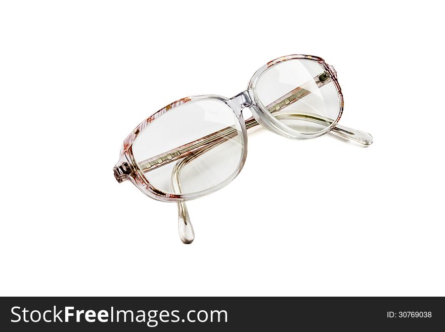 Vintage eyeglasses in a pink frame isolated over white