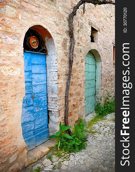 Two old doors in a typical stone village of Italy. Two old doors in a typical stone village of Italy