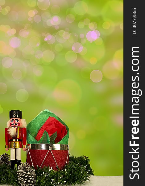 Nutcracker with Christmas decorations and bokeh background. Nutcracker with Christmas decorations and bokeh background