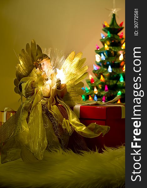 Angel tree topper with tree in background