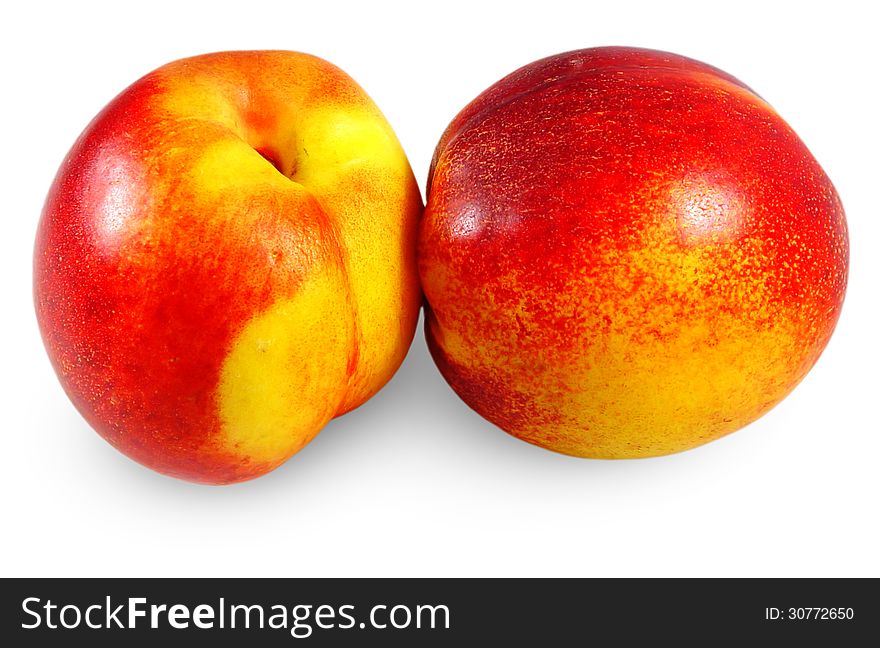 Two ripe apricots on a white background
