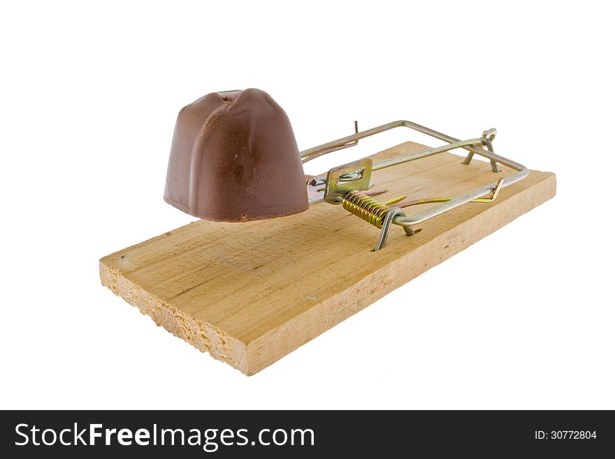 Conceptual image of chocolate on a mousetrap. Conceptual image of chocolate on a mousetrap.