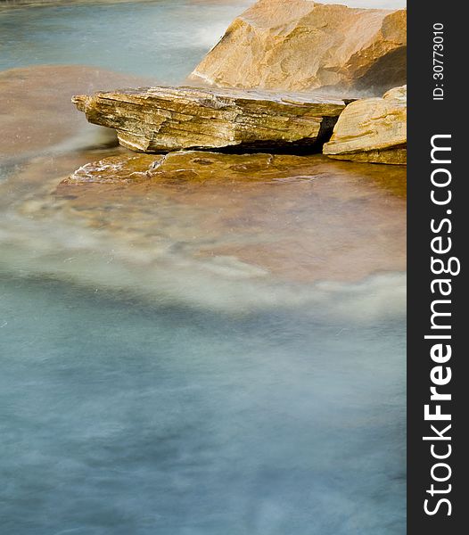 Detailed view of a water fountain with moving water. Detailed view of a water fountain with moving water.