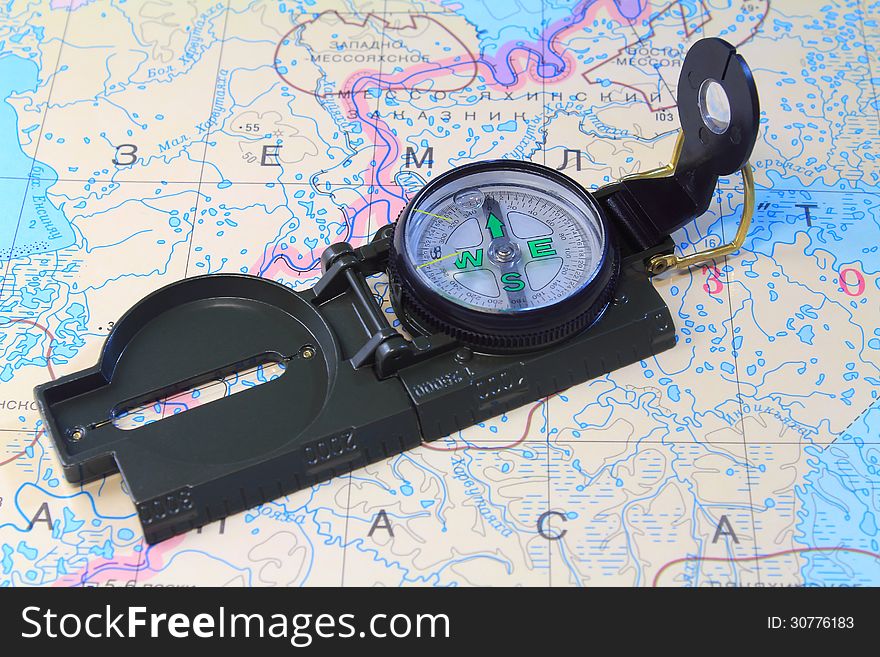 A Compass And A Map Of The North Of Russia