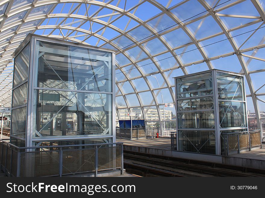 Modern tram station covered with elevators in each direction for people