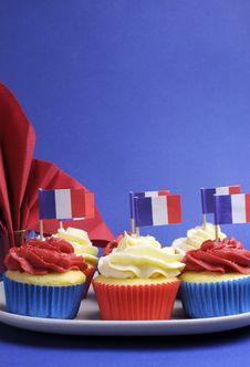 French Theme Red, White And Blue Mini Cupcake Cakes With Flags Of France - Vertical. Stock Images