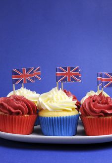 English Theme Red, White And Blue Cupcakes With Great Britain Union Jack Flags - Vertical With Copy Space. Stock Photo English Theme Red, White And Blue Cupcakes With Great Britain Union Jack Flags - Vertical With Copy Space. Stock Photo