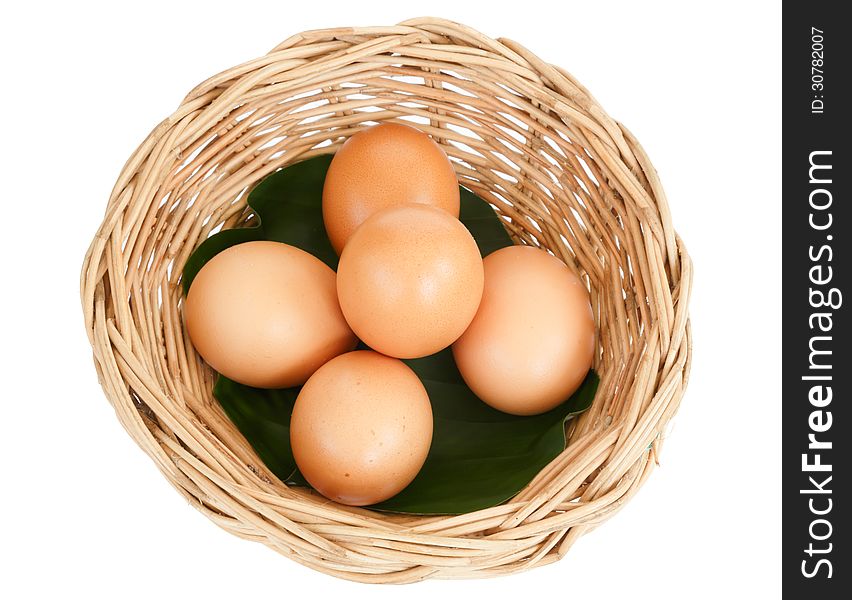 Egg in basket isolated on white background. Egg in basket isolated on white background