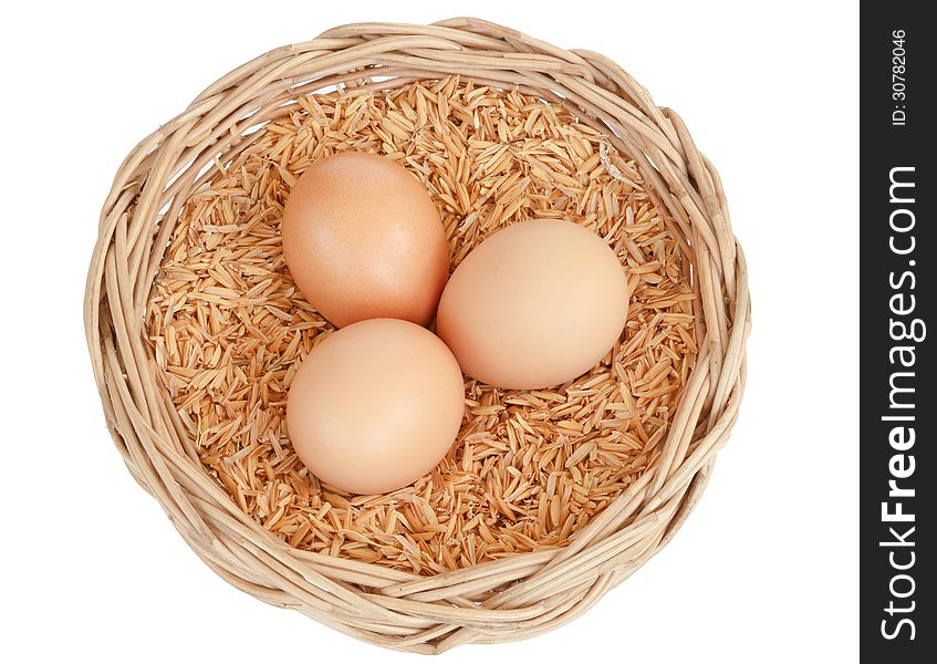 Egg in basket isolated on white background. Egg in basket isolated on white background