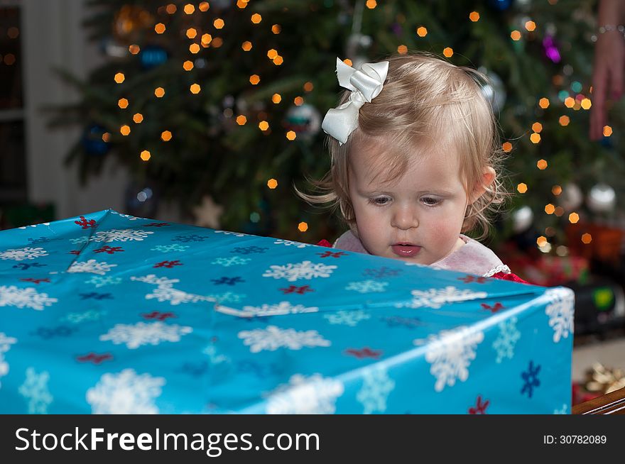 Little Girl opening Christmas Present