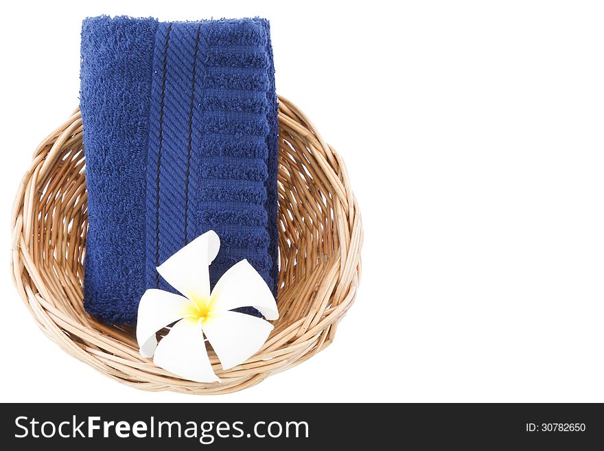 Towel in basket isolated on white background.