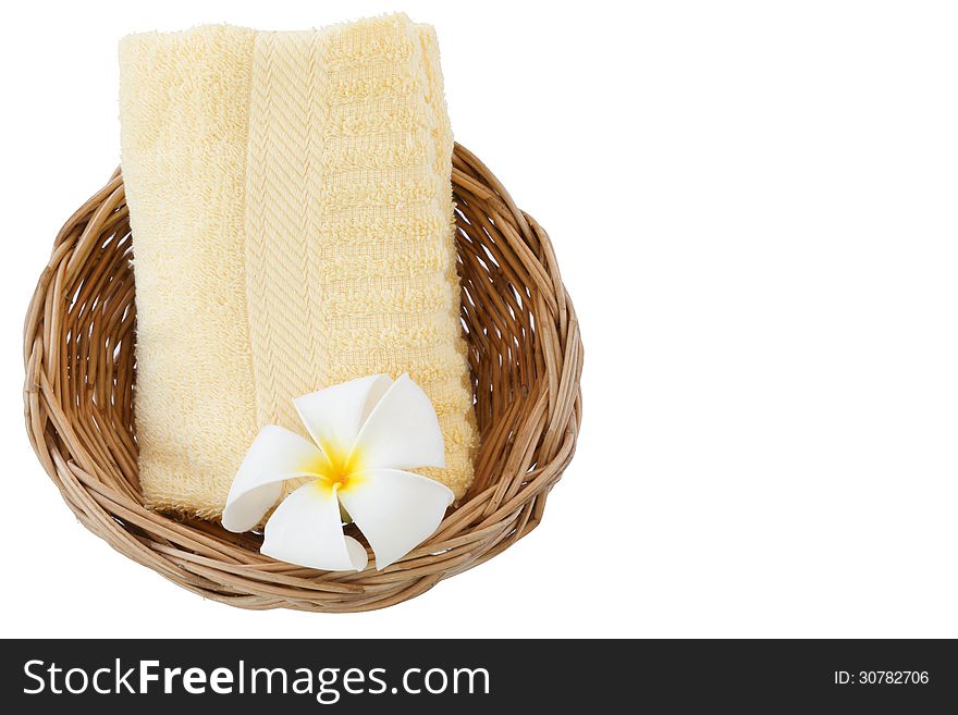 Towel in basket isolated on white background.