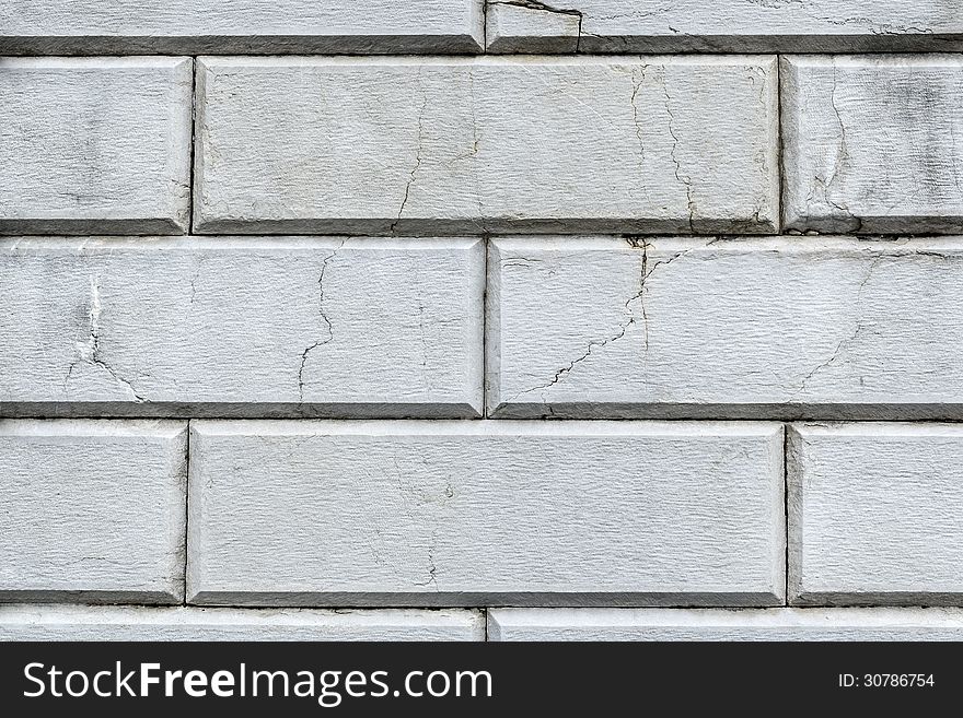 Old white wall of stone blocks in retro style. Old white wall of stone blocks in retro style