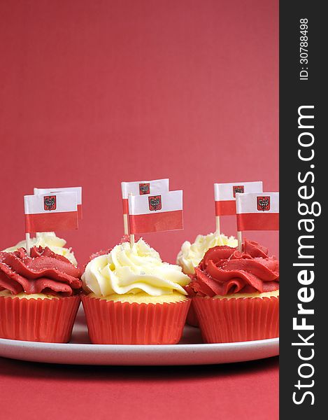 Polish red and white decorated cupcakes with Poland flags for November 11, National Independence Day celebrations or national holiday party. Polish red and white decorated cupcakes with Poland flags for November 11, National Independence Day celebrations or national holiday party.