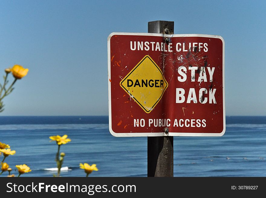 Warning sign at Sunset Cliffs in San Diego, Califonia. Warning sign at Sunset Cliffs in San Diego, Califonia