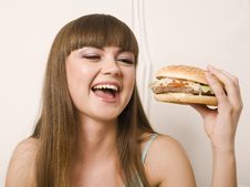Portrait Of Young Pretty Woman With Burger Stock Photo